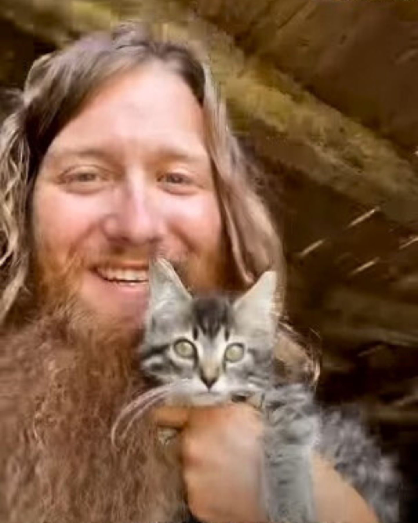 guy holding kitten