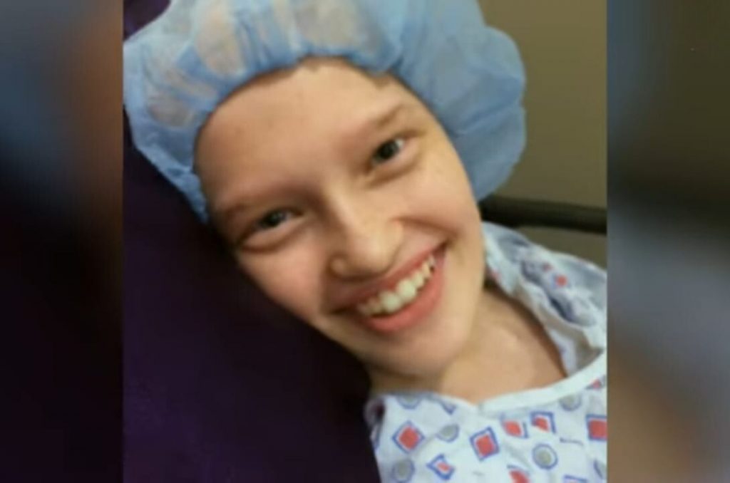 smiling sick girl in hospital