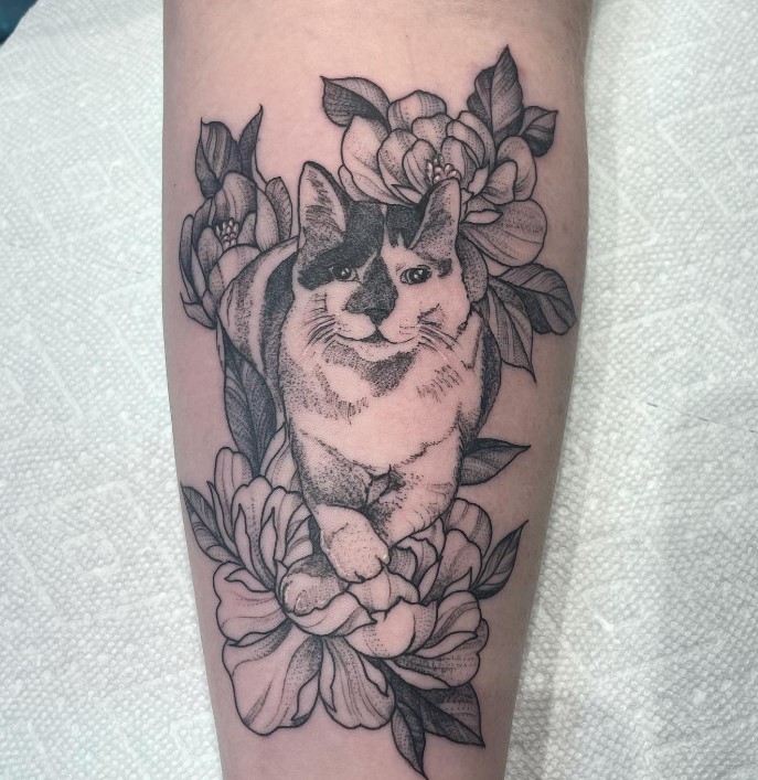 cat tattoo on arm