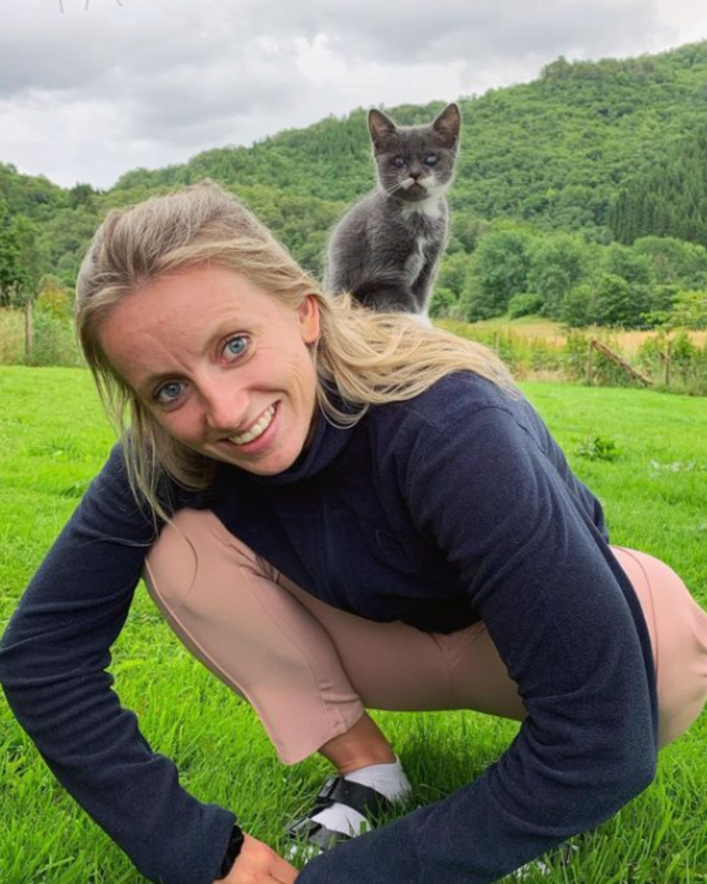 kitten sitting on woman's shoulder