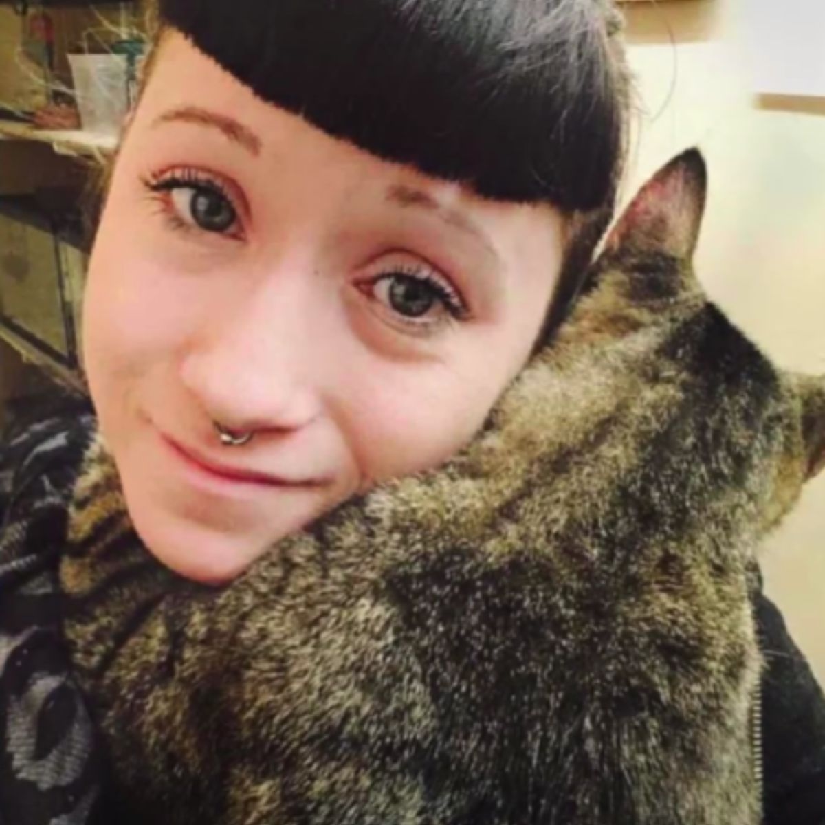 woman and cat hugged together