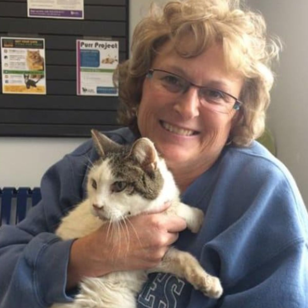 woman holding a cat