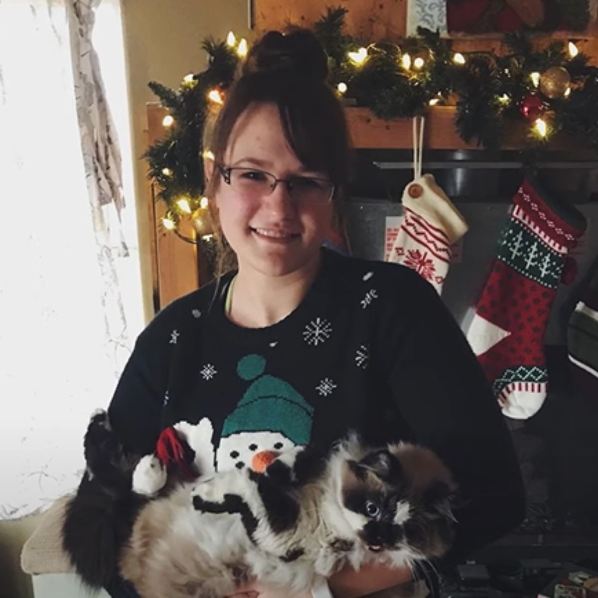 woman with cat for christmas