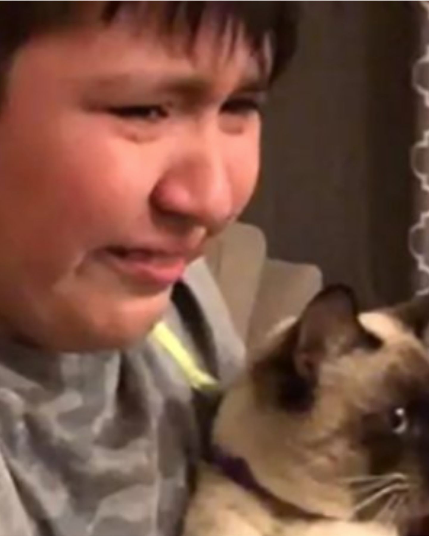 crying boy with cat