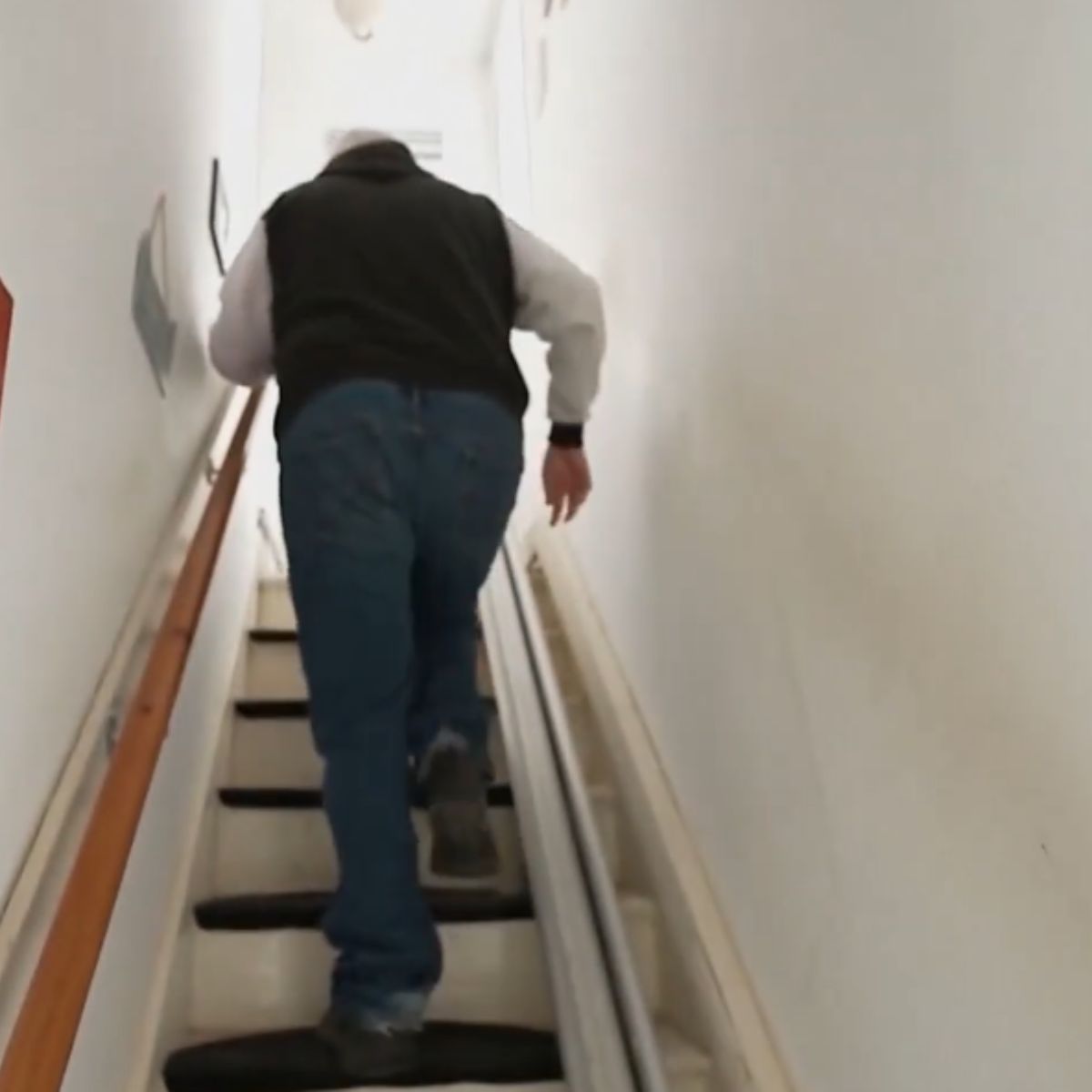 man climbing up the stairs