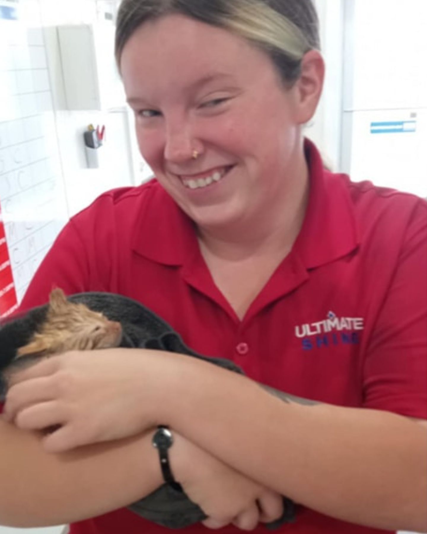 woman holding a kitten