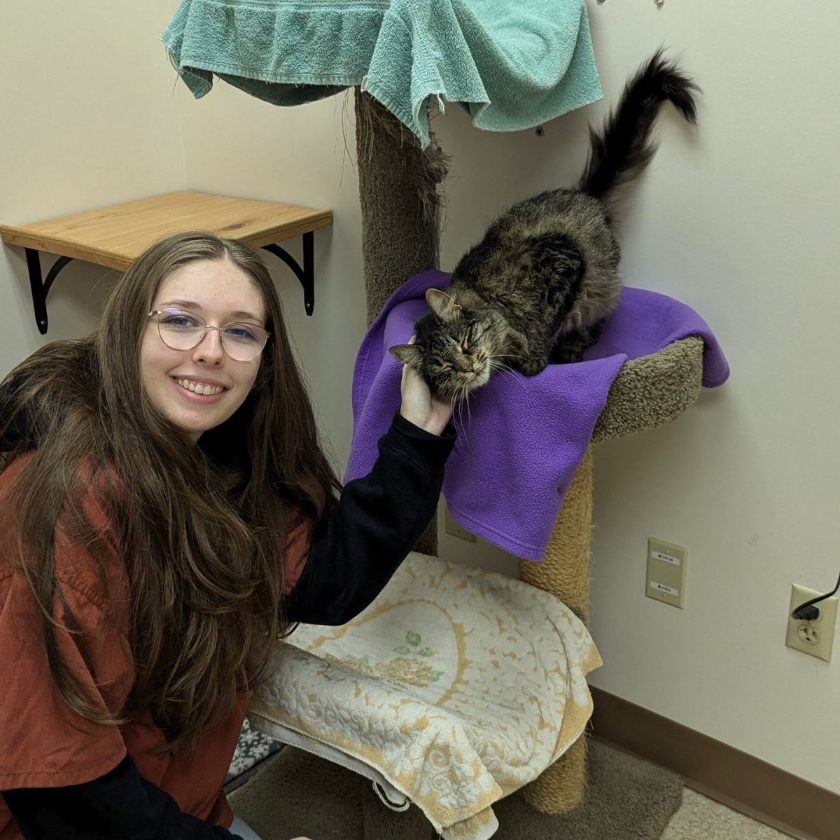 young woman posing while carresing cat