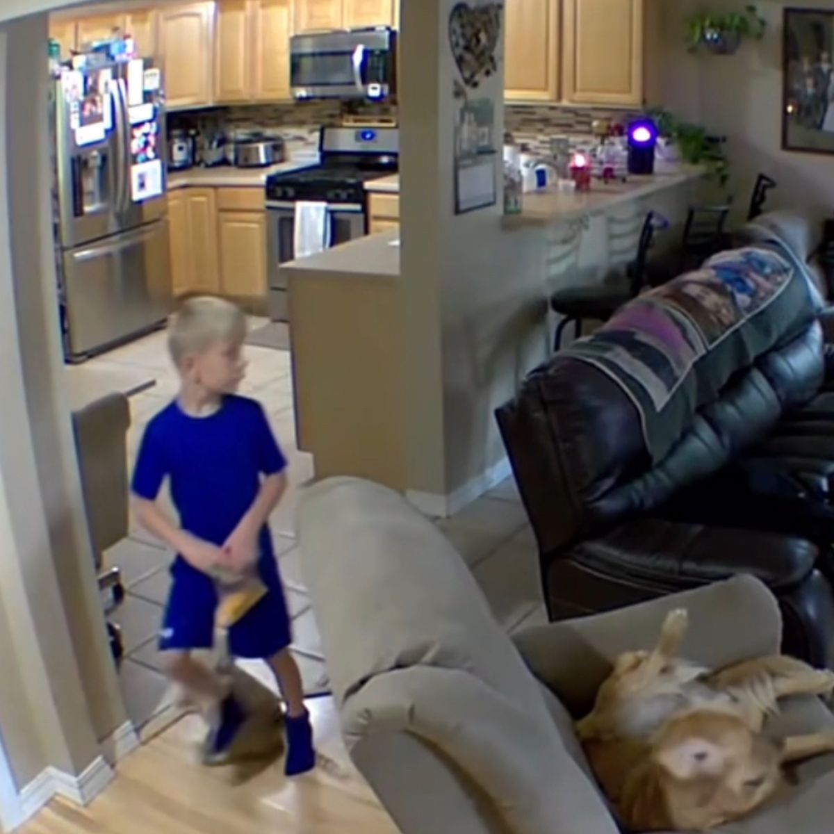 boy walking through the house