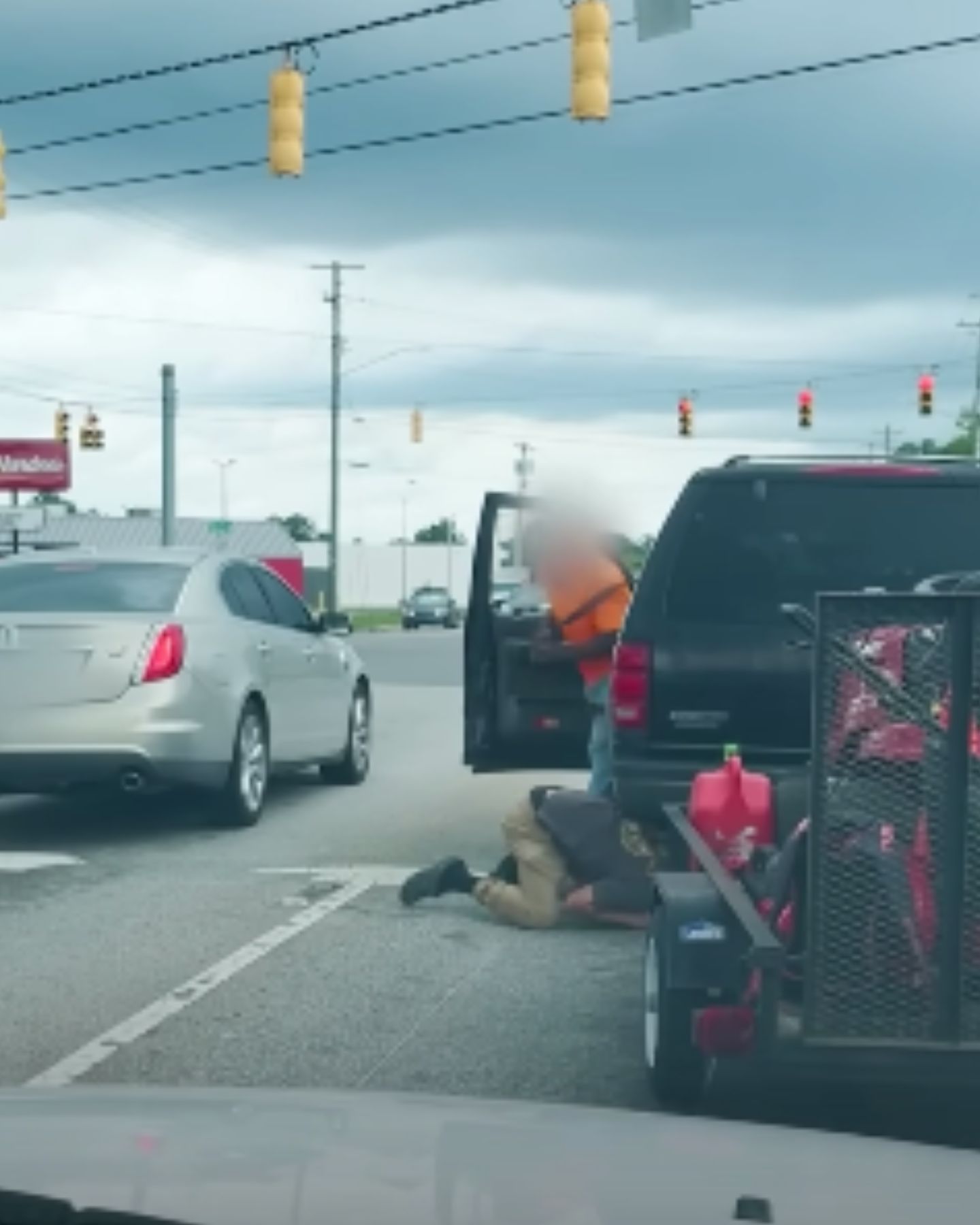 man looking under the car