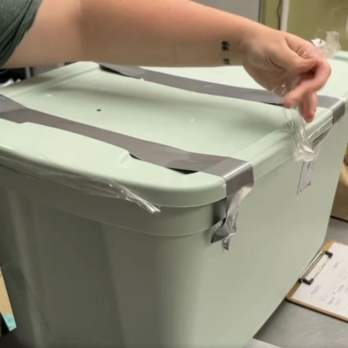 man opening a bin