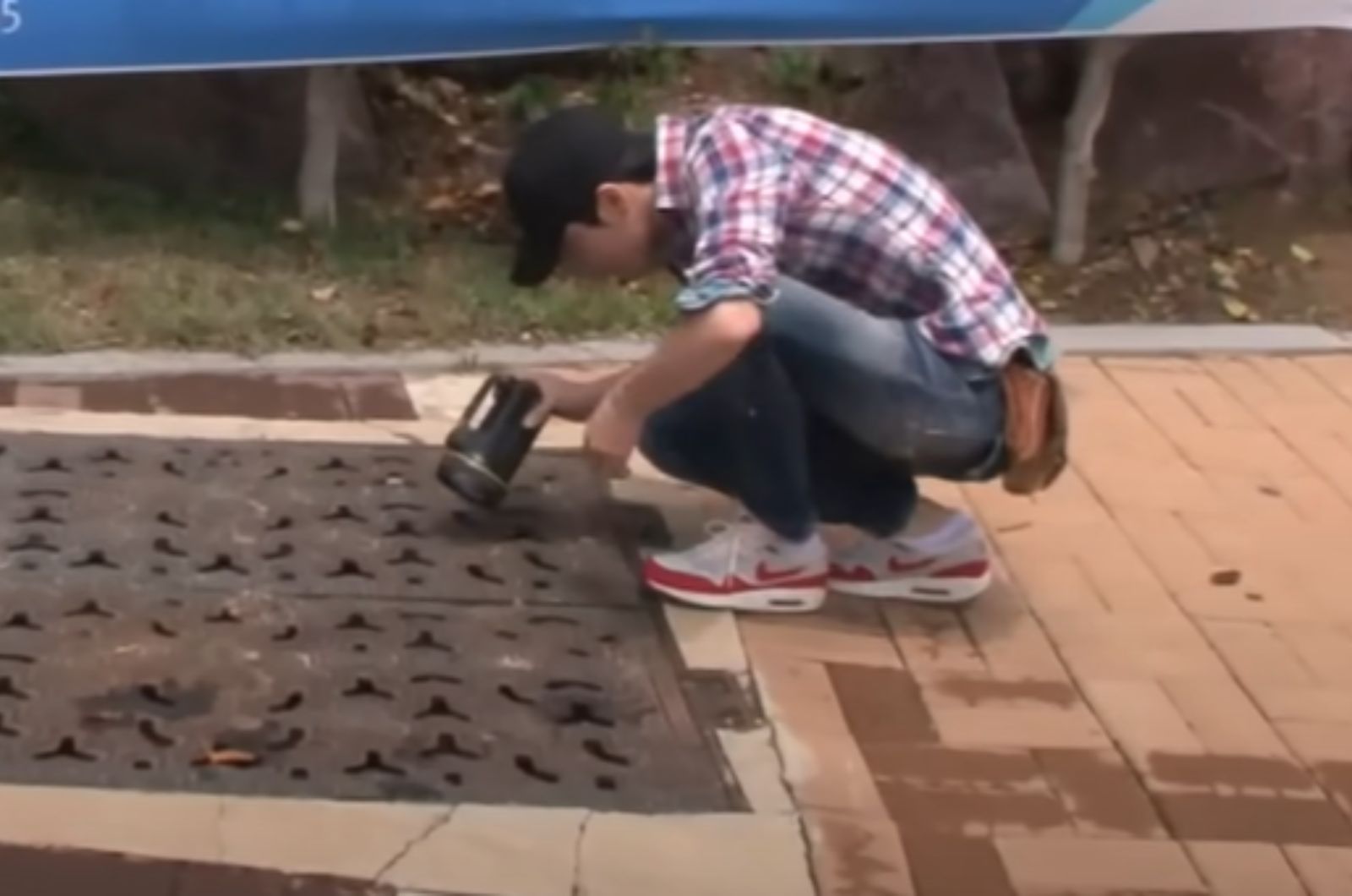 man peeking in sewer