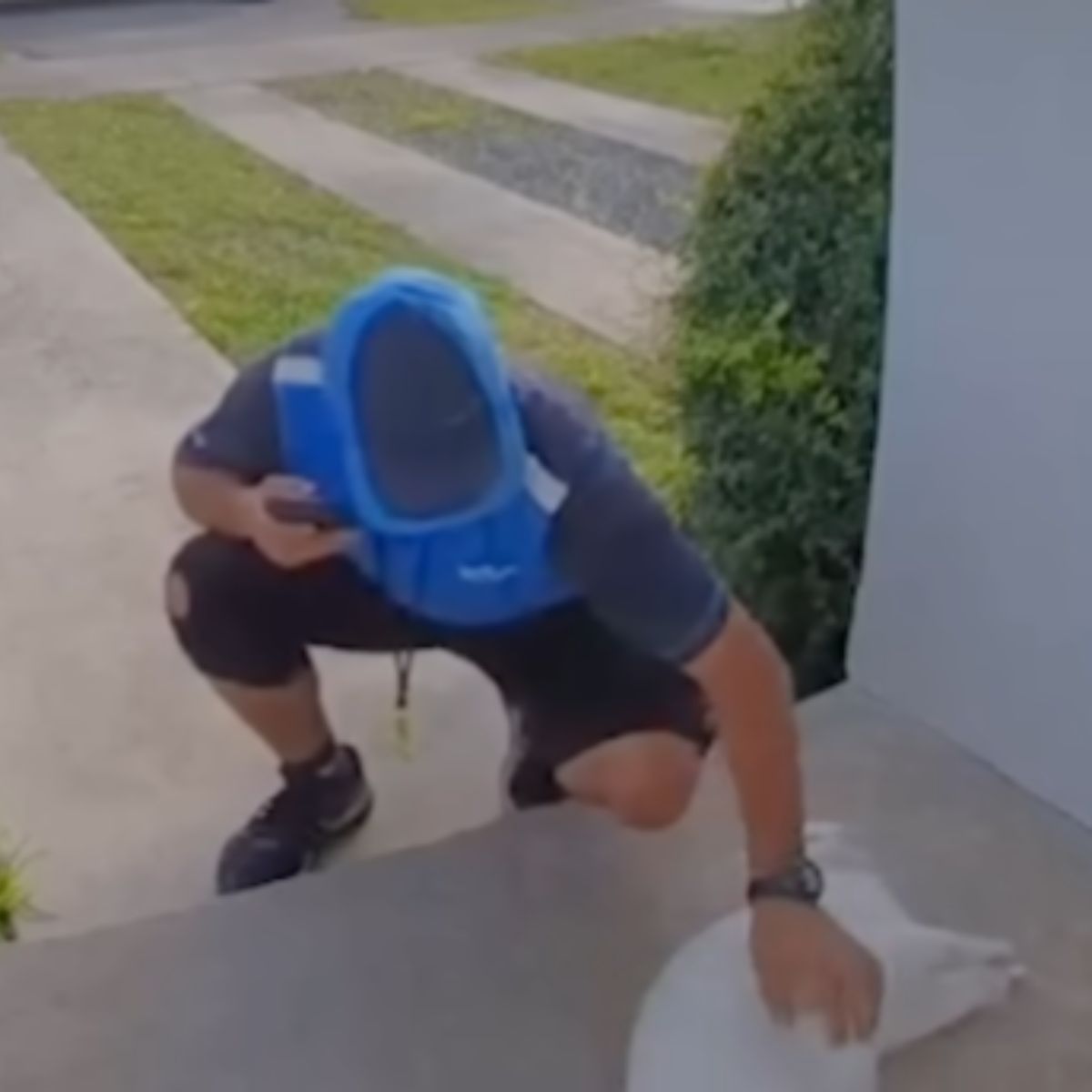 man with hat snuggling cat