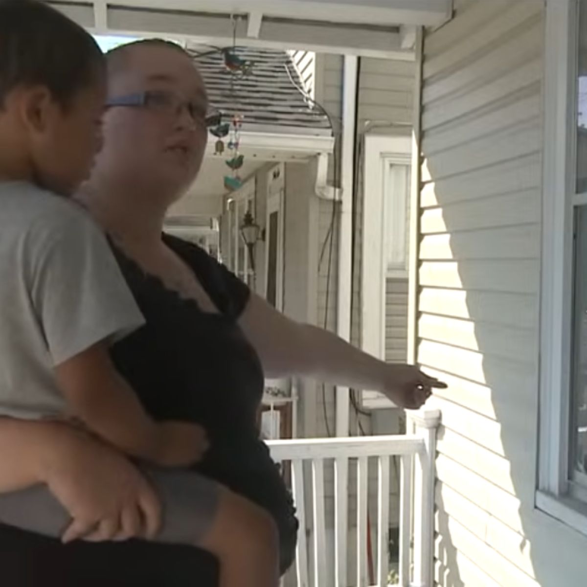 woman holding a boy