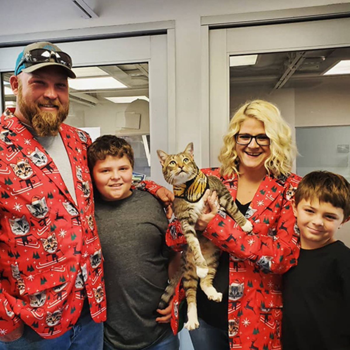 happy family with their adopted cat