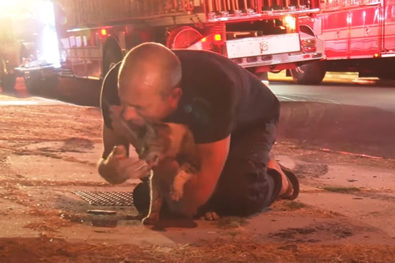 man crying and holding a cat