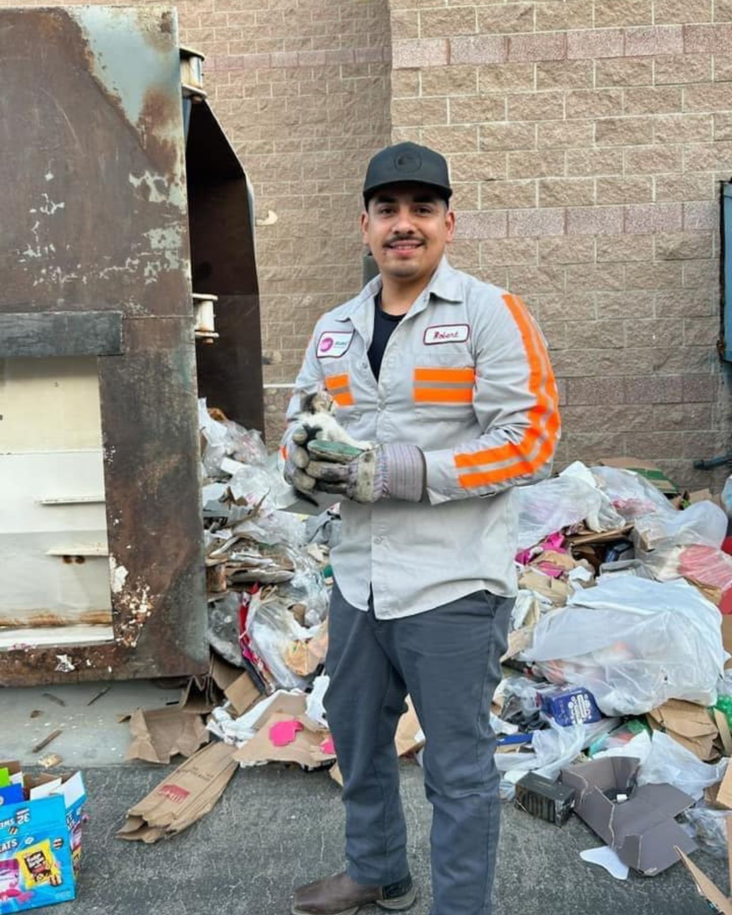 smiling rescuer posing with kitten