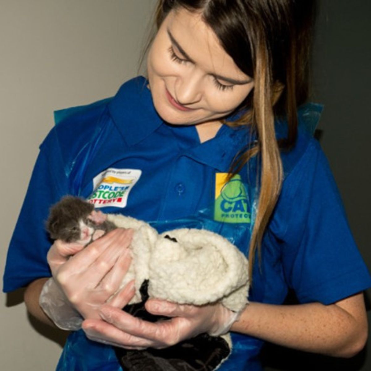 woman holding a kitten