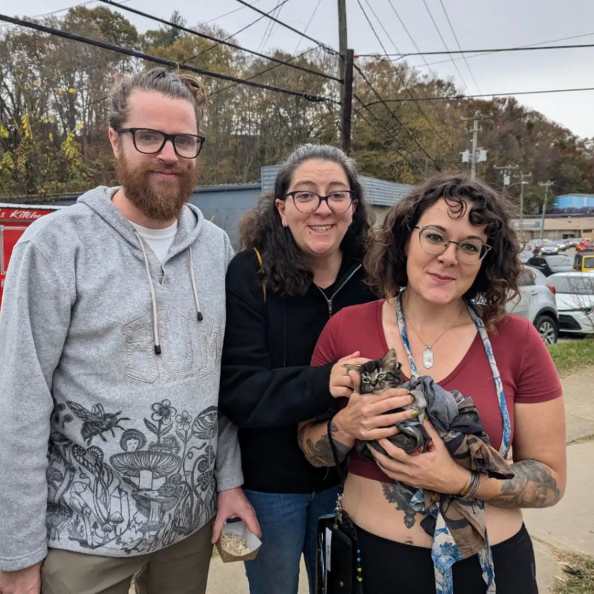 woman holding sweet kitten