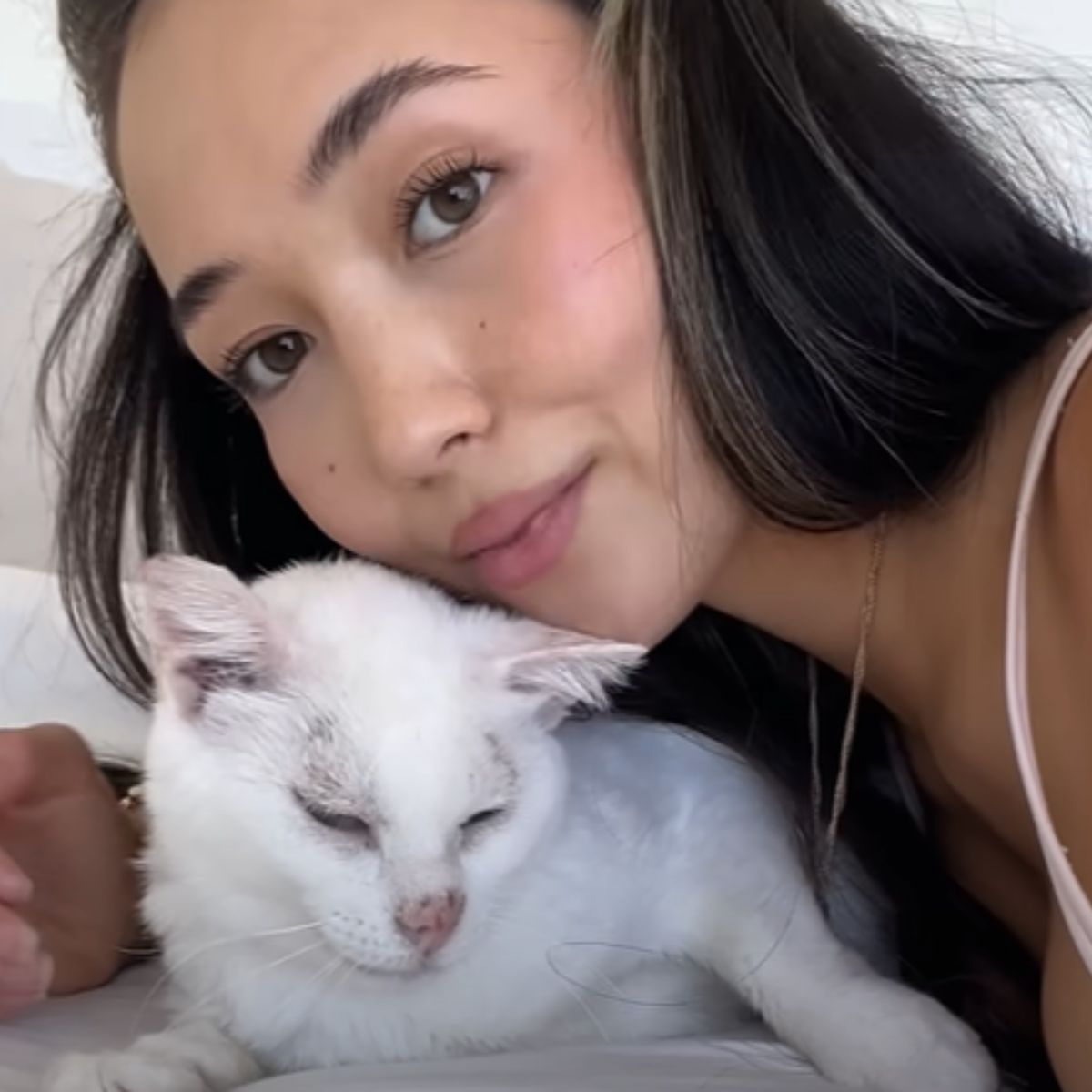 young woman posing with cat