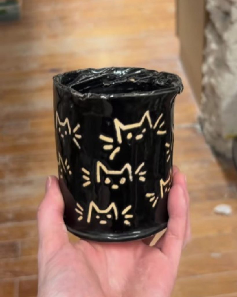 black bowl with cat motifs