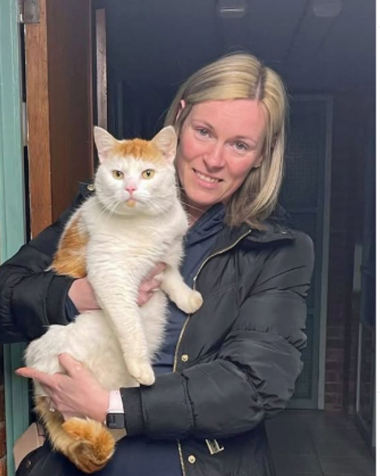 woman holding a cat