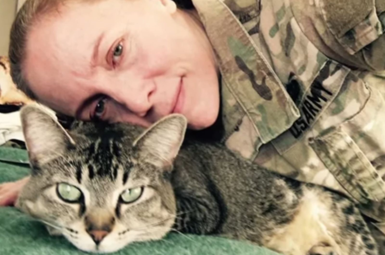 woman soldier with cat