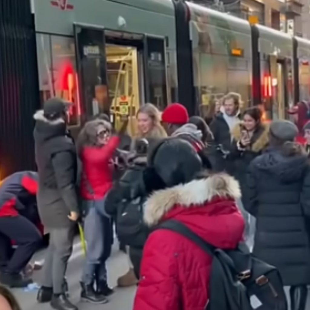 people are standing on the road