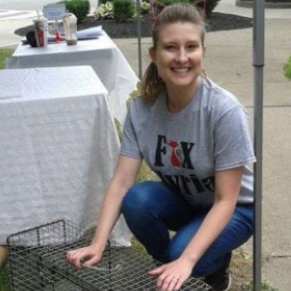 smiling woman with cage