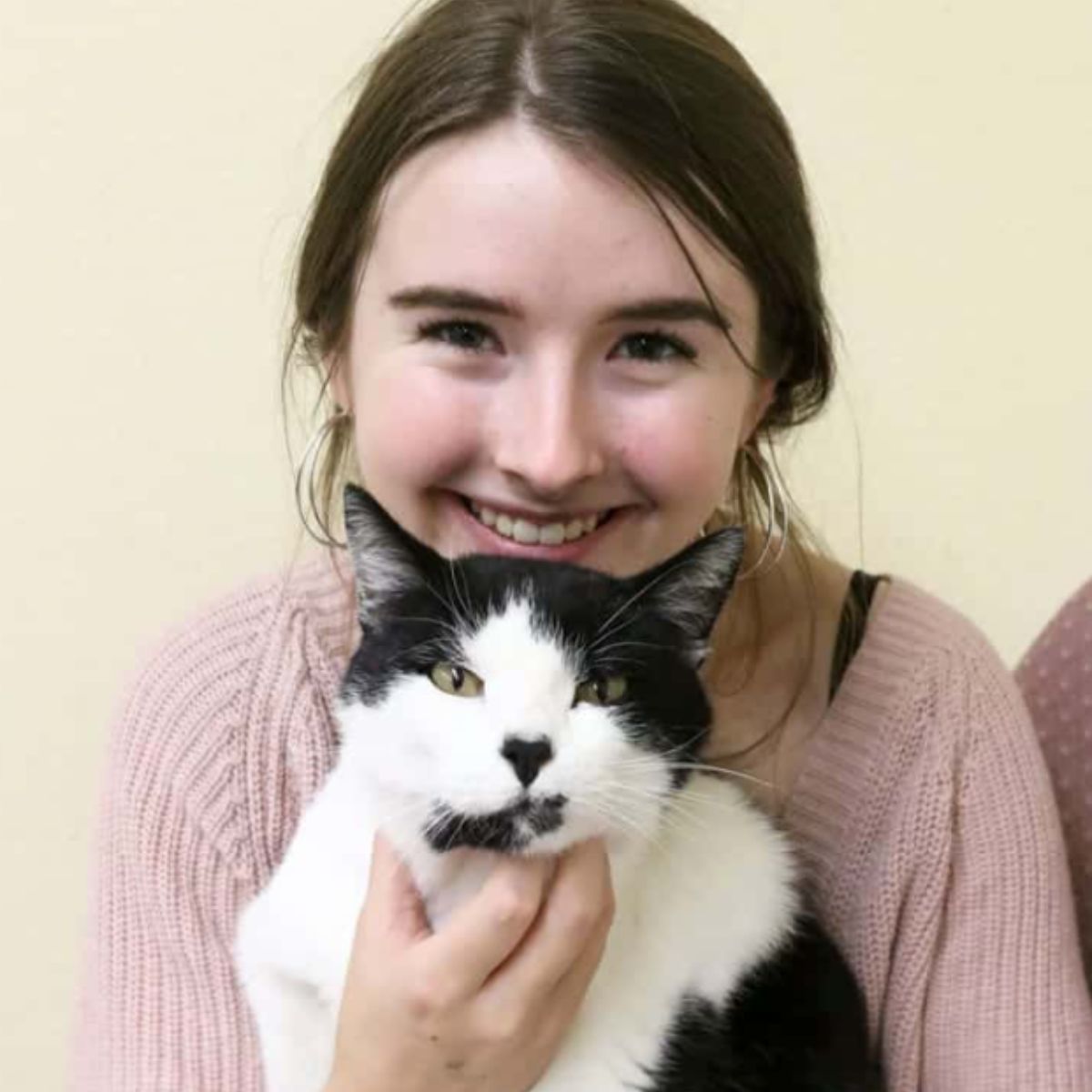 teen holding a cat