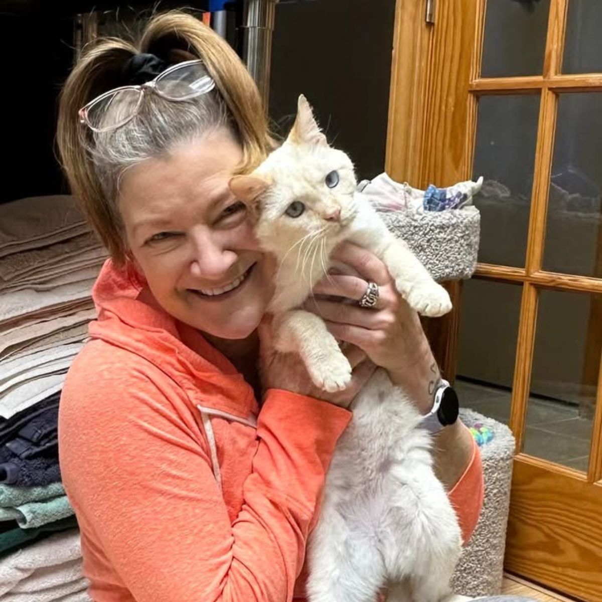 woman holding a rescued cat