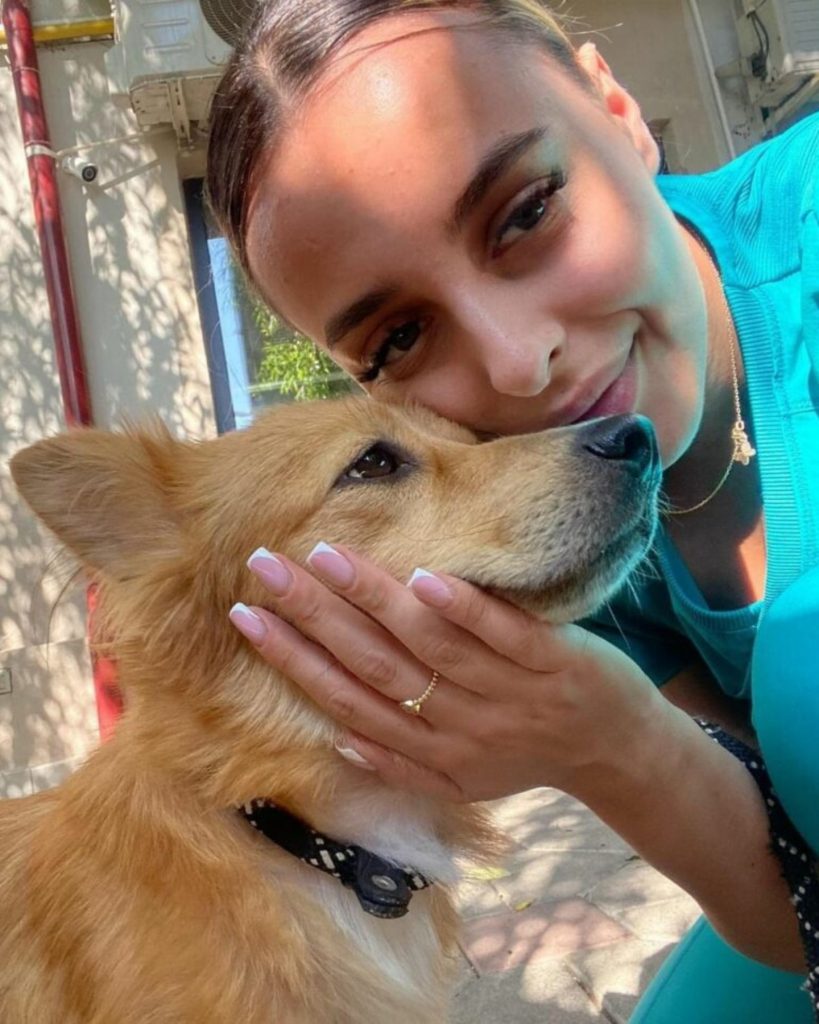 young woman hugging a dog