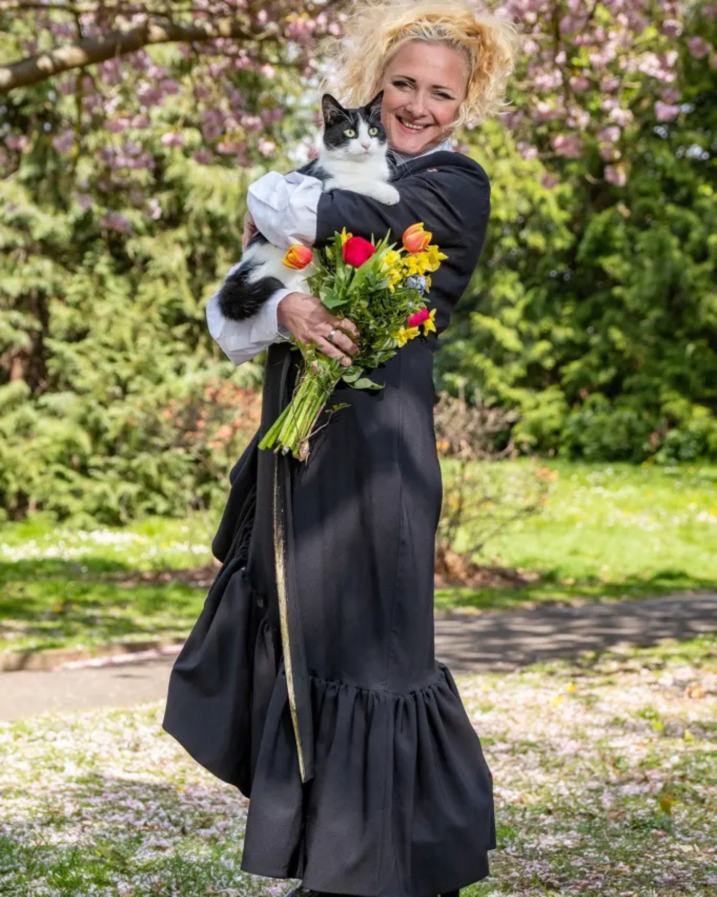 happy woman holding a cat