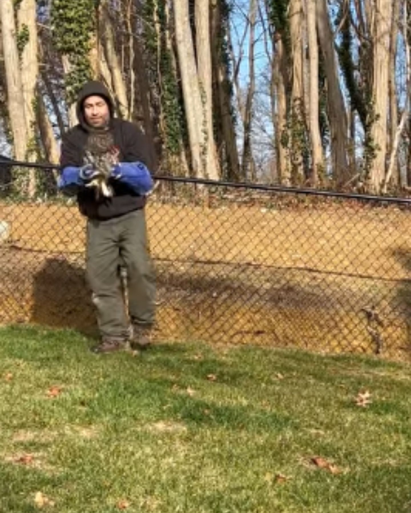 man holding an owl