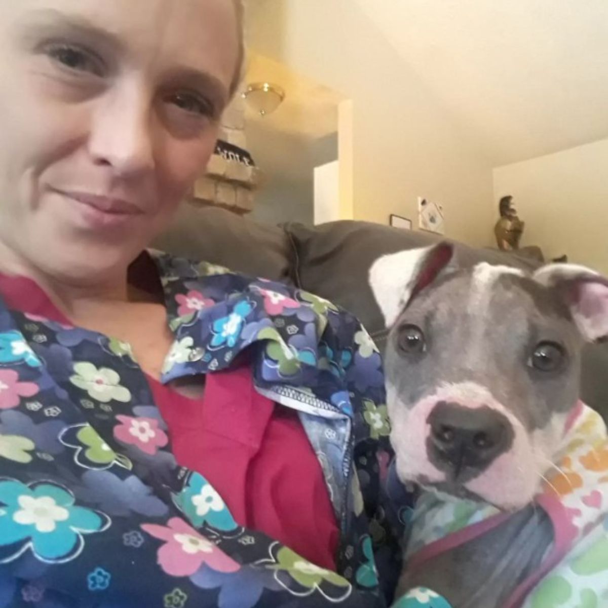 woman and hairless puppy