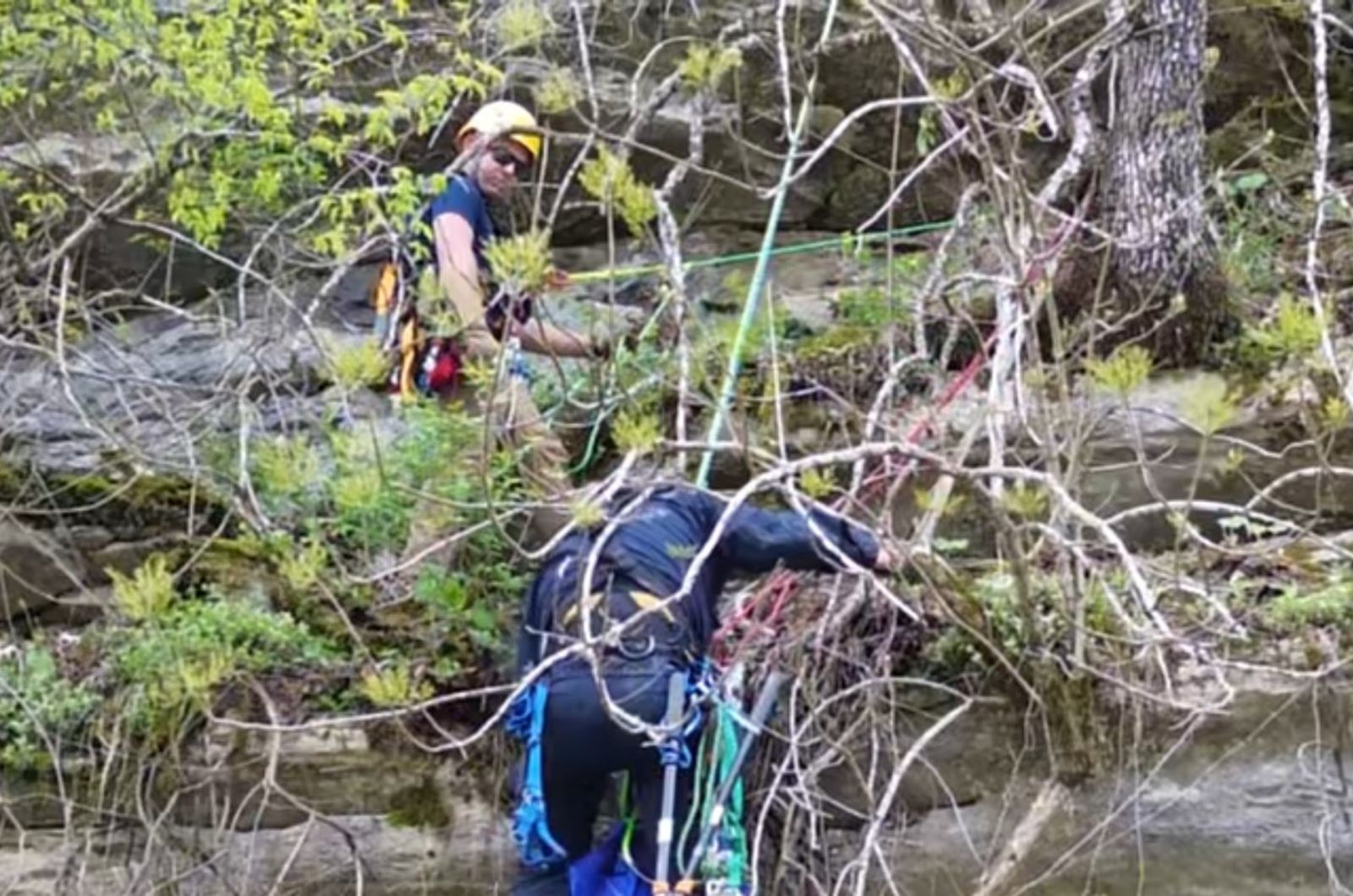 rescuers on cliff