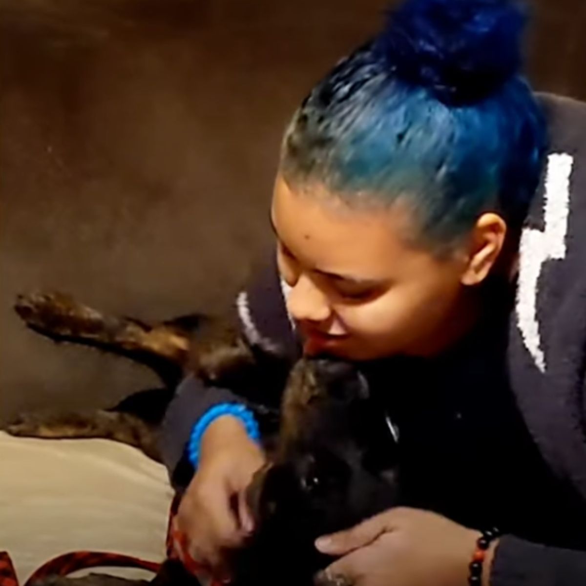 woman with blue hair and dog