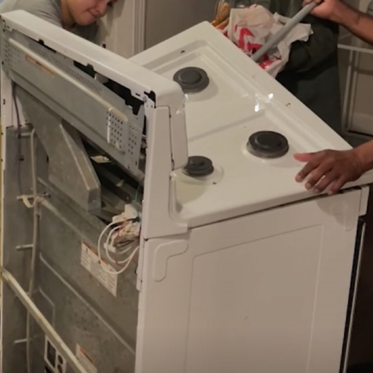 man breaking a stove