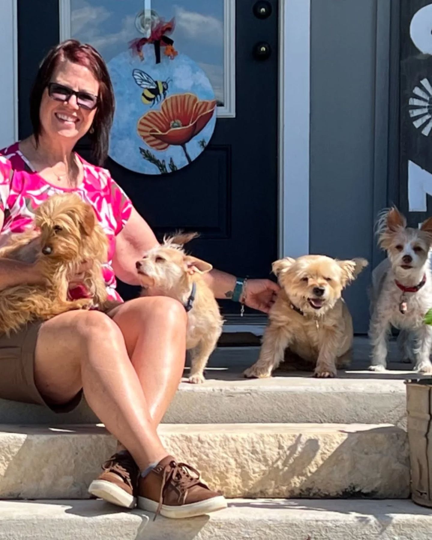 woman and four dogs