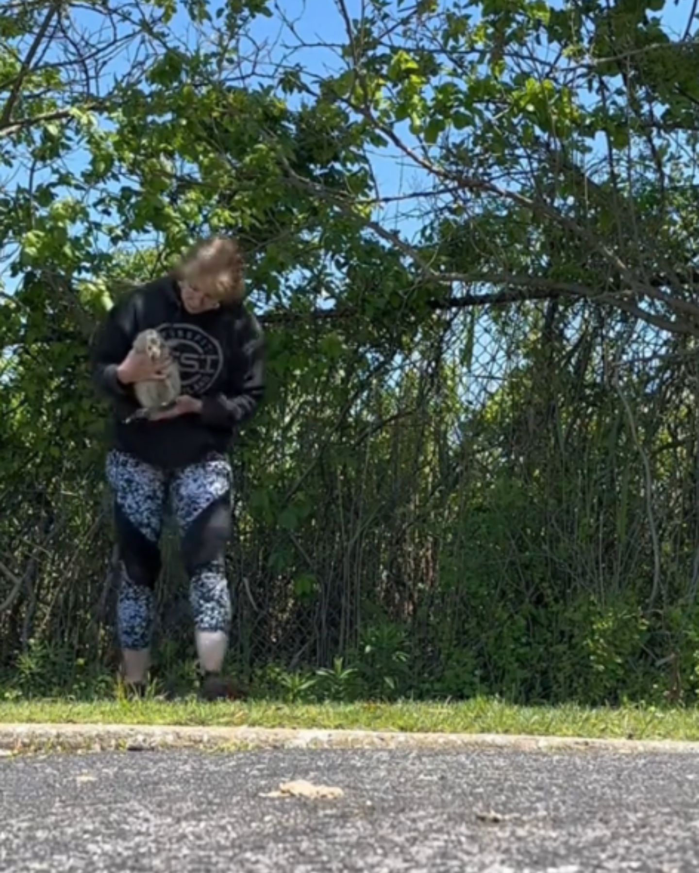 woman holding a goose