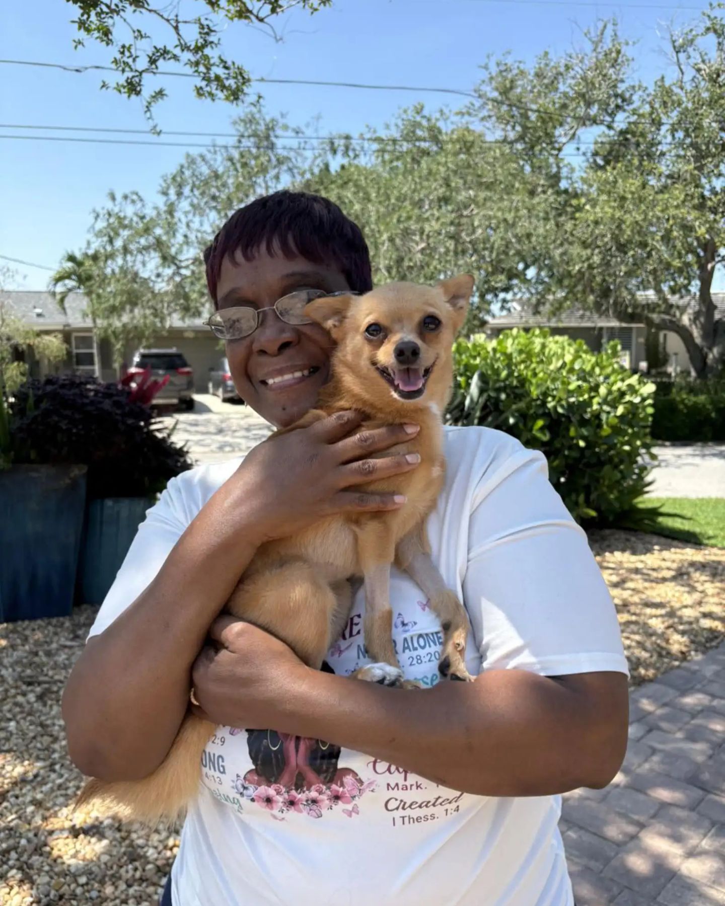 woman holding a small dog