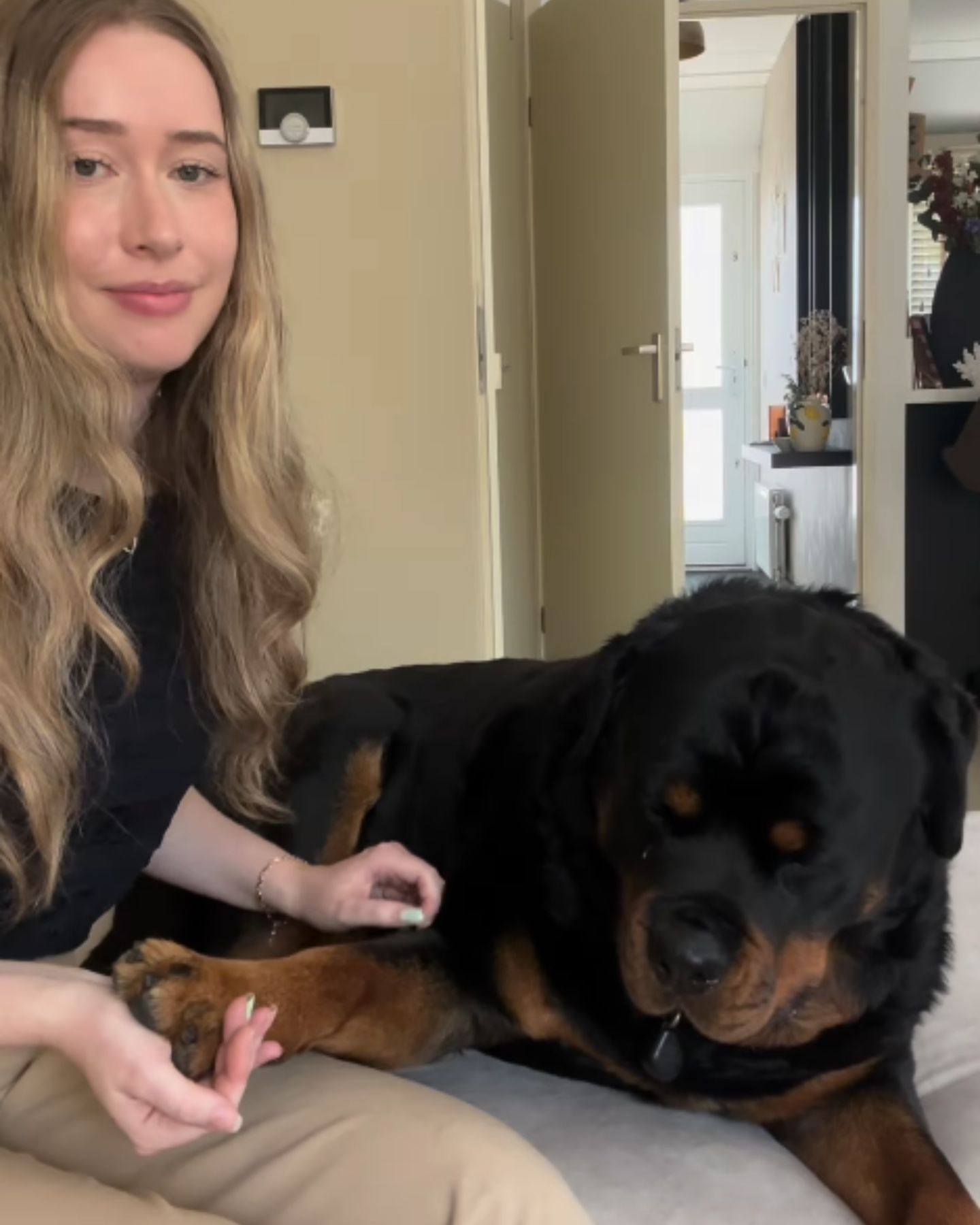 blonde woman and Rottweiler