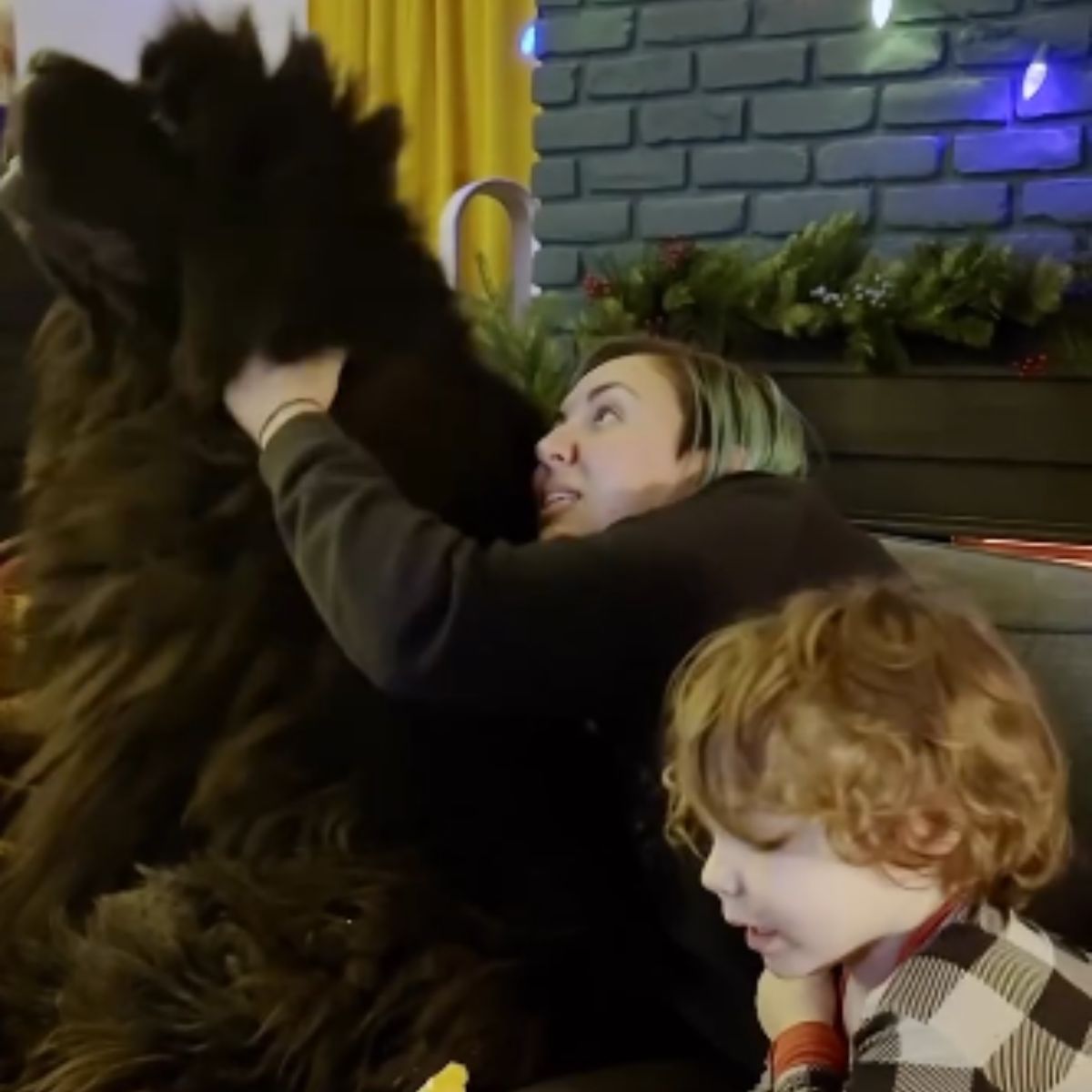 blonde woman and black dog