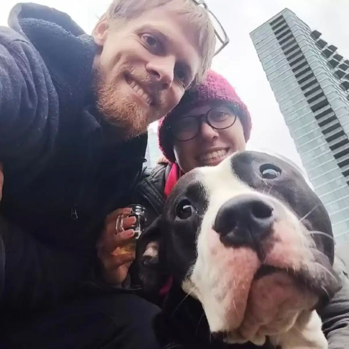man and woman with a dog