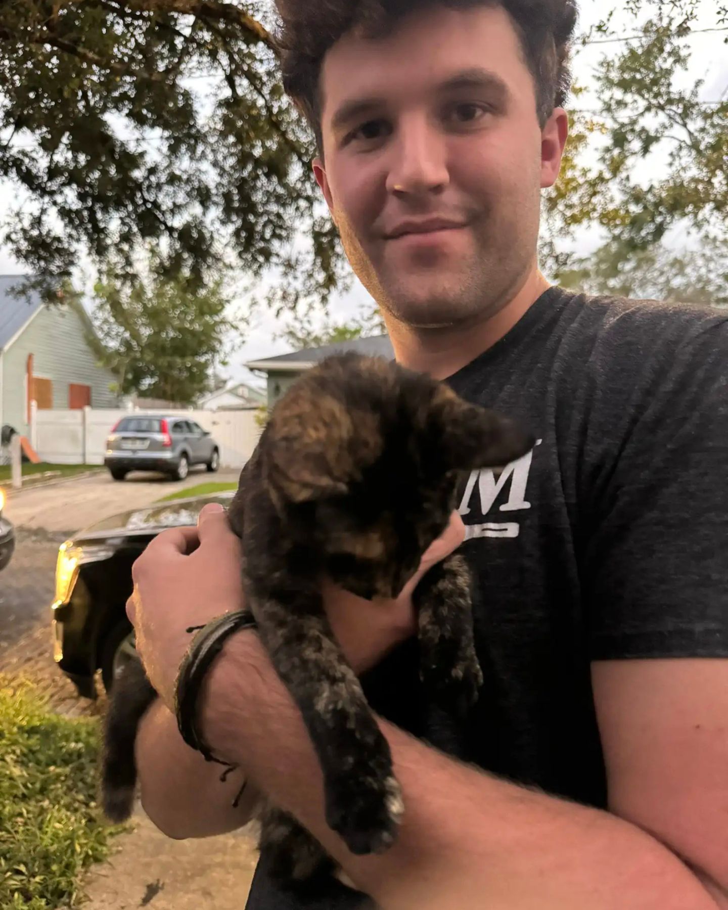 man holding the cat