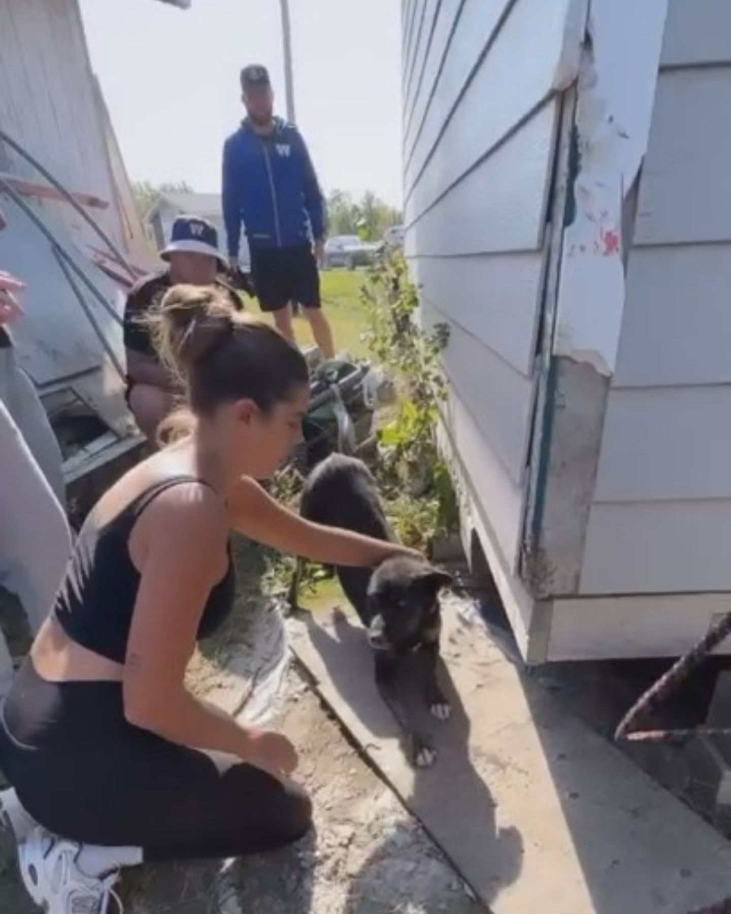 woman and black dog