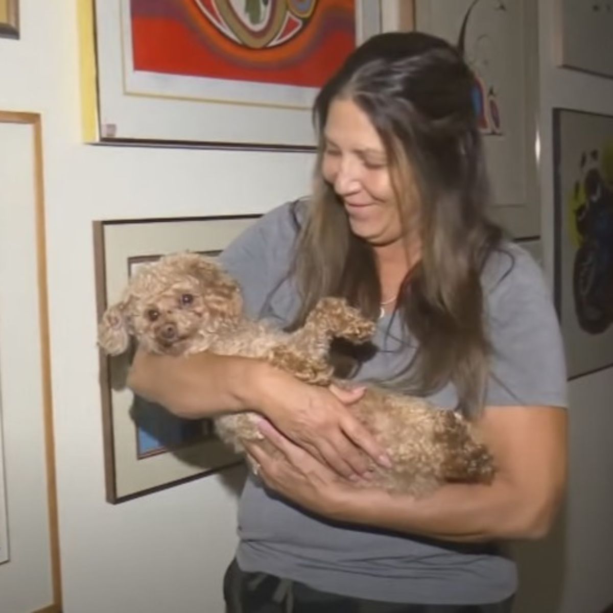 woman holding a sweet dog