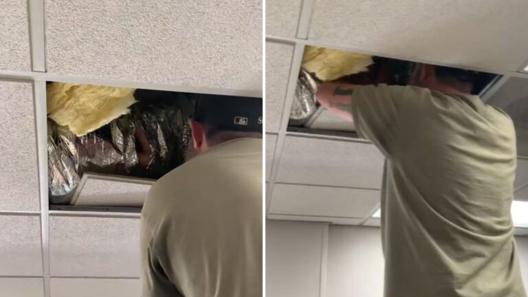 man checking the ceiling vent