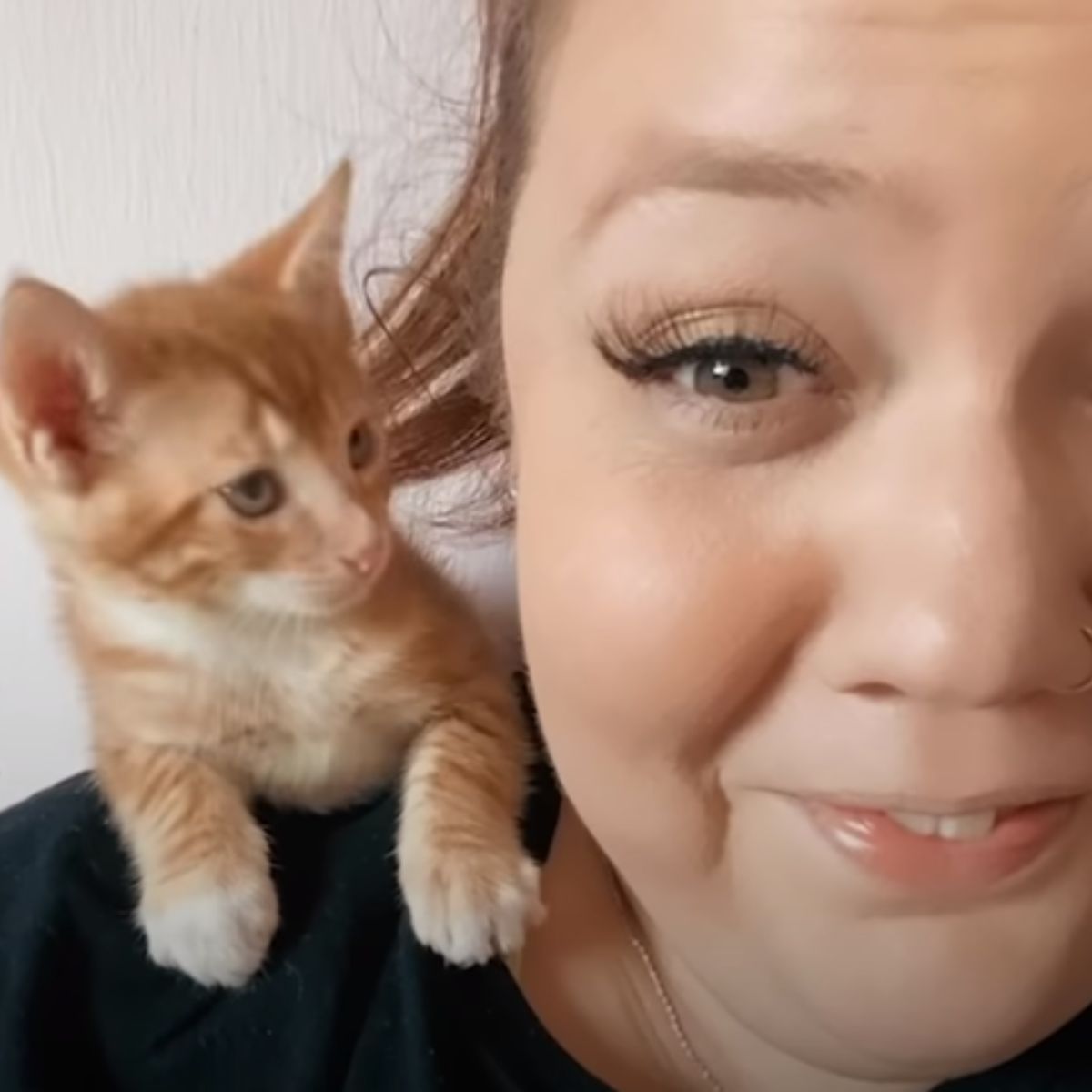 funny woman and little kitten