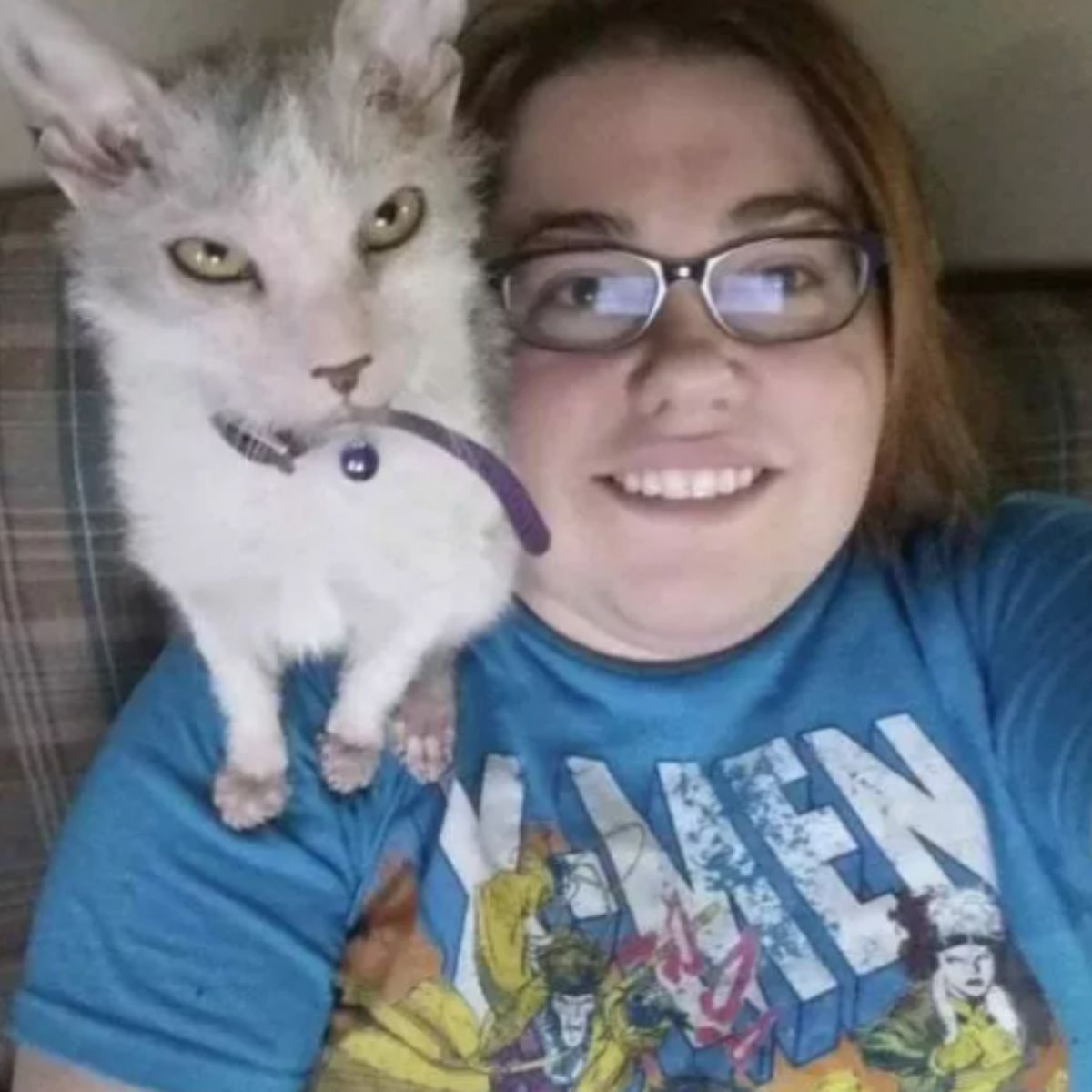 kitten on woman's shoulder