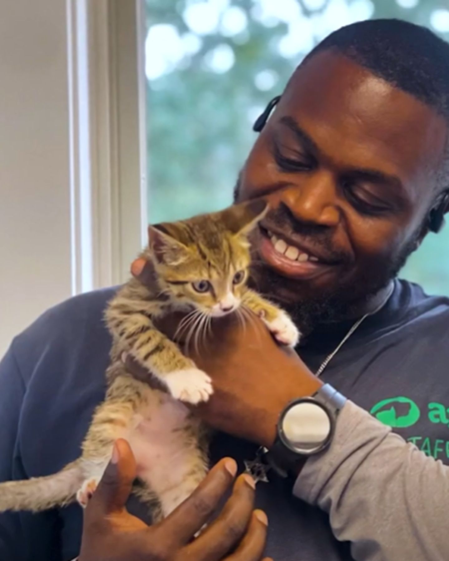 man holding a cat